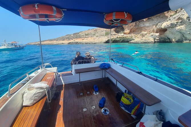Boat Charters Blue lagoon, Crystal Lagoon, Comino, Malta 4hr trip - Passing St Mary’s tower and using the movie connection as an extra layer