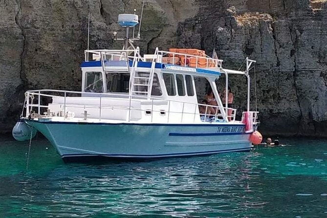 Comino Blue Lagoon and Gozo Private Boat Charter: Lucky Lady Boat - Crystal Lagoon and Comino caves: clearer water, film-famous rockwork