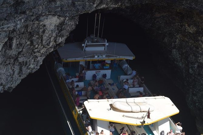 Comino Island: including Blue Lagoon, Crystal Lagoon & sea caves - The cruise view: St Pauls Island, Malta cliffs, and quick cave photo moments