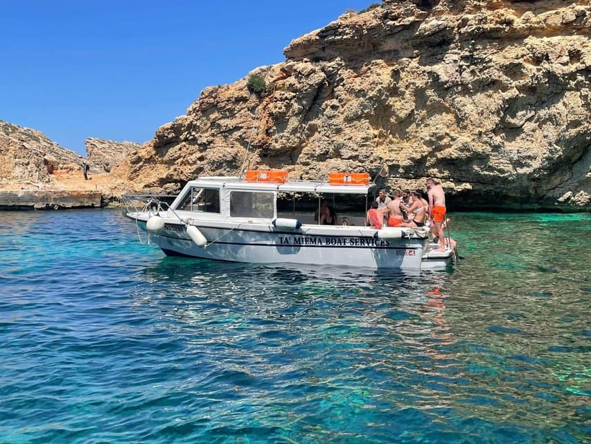 Comino: Private Boat Trips, Swimming stops and Caves Tours - Getting on the Julie Pearl: shade, ladder, toilet, and Bluetooth music