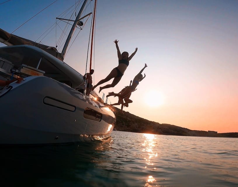 Evening Catamaran Charter - Stand-up paddleboarding at dusk: fun, but plan your balance