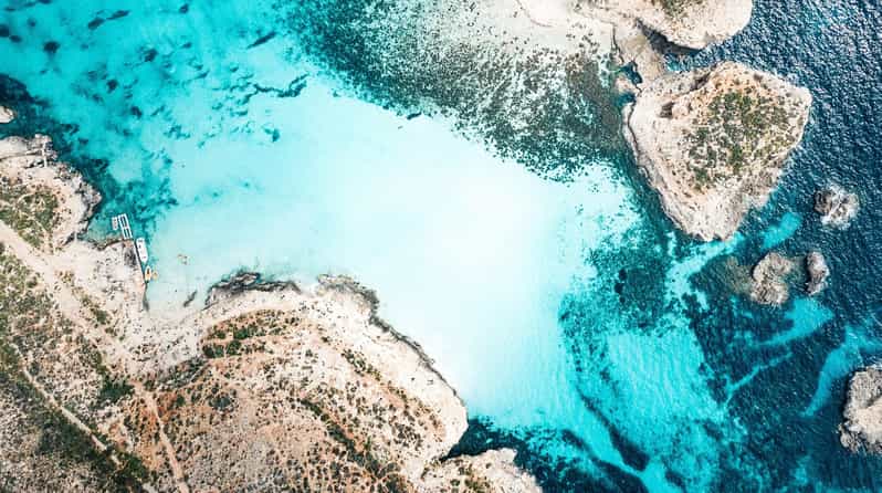 From Mellieha: Three Bay Cruise including the Blue Lagoon - Crystal Lagoon on Comino: Shorter Stop, Big Cave and Snorkel Payoff