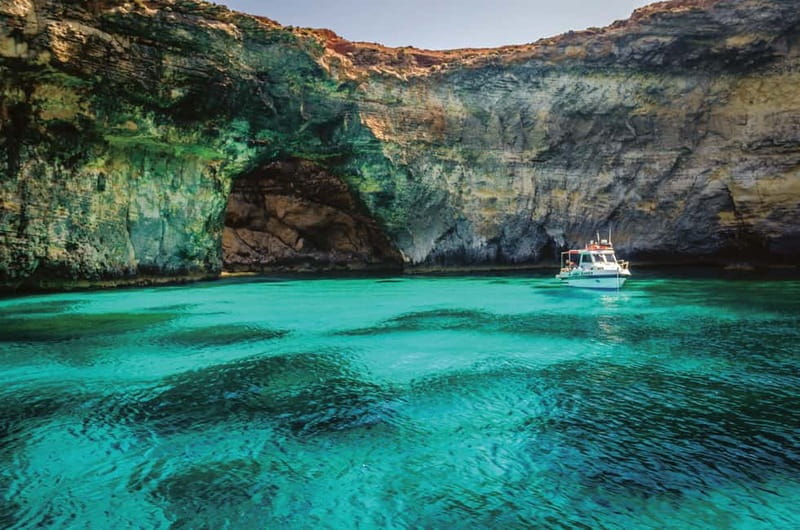 From Sliema: Comino Blue Lagoon Return Trip (CMO) - Onboard comfort: air-conditioned space, plush seating, and Wi-Fi
