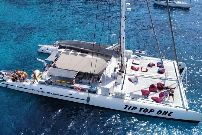 Full-Day Catamaran Cruise with Lunch in Island of Malta - The feel on board: drinks, restrooms, shaded tables, and space to actually relax