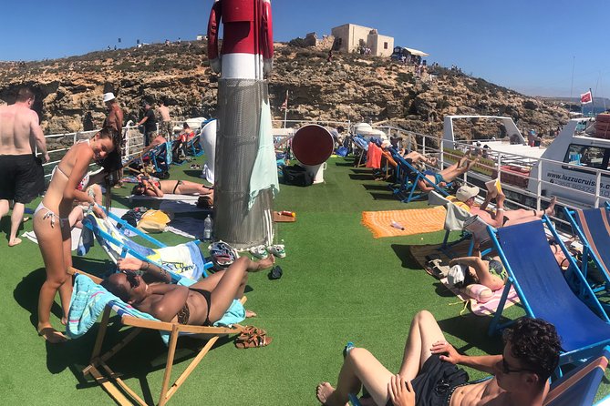 Malta: Comino, Blue Lagoon & Caves - swim, snorkel & slide - Why this Comino day feels so special from a boat