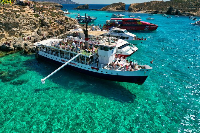 Malta: Comino, Blue Lagoon & Caves - swim, snorkel & slide - The cruise part: St. Paul’s statue, Mellieha Bay, Ahrax cave, and Coral Cove