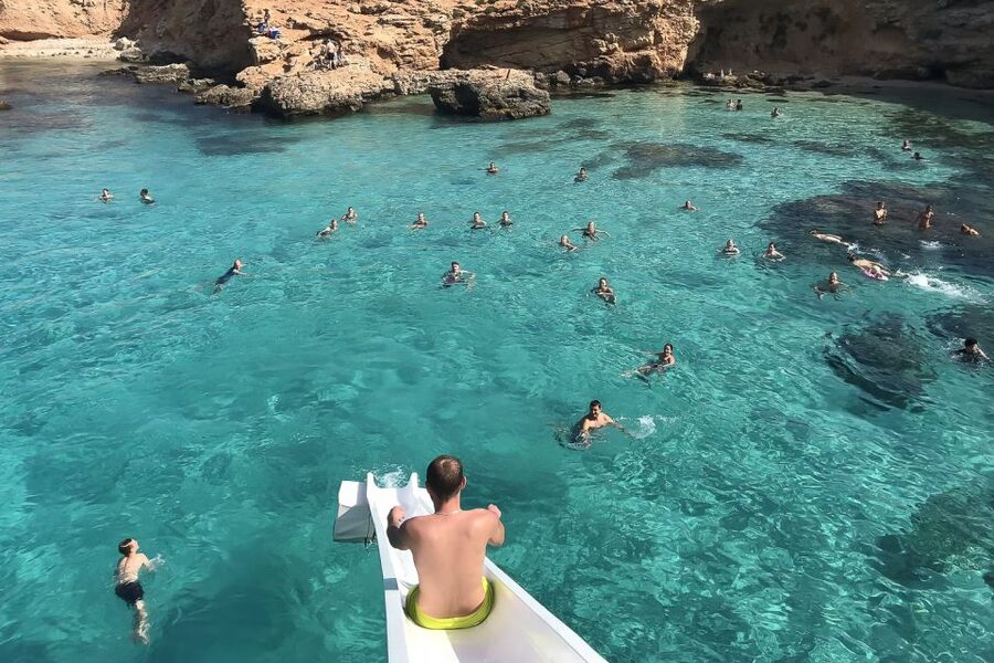 Malta: Gozo, Comino, Blue & Crystal Lagoon, & Caves Cruise - Comino time: stay on the boat, use the deck, and play on the slide