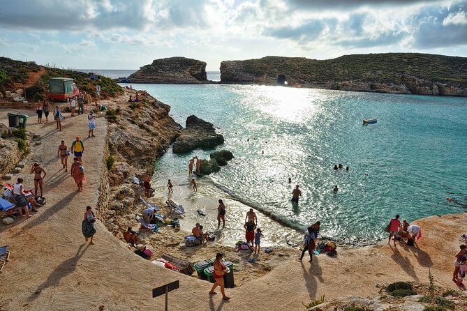 Malta Sunset Boat Tour: Bugibba to Comino Blue Lagoon Cruise - The 10-meter water slide plus snorkel options: the action plan