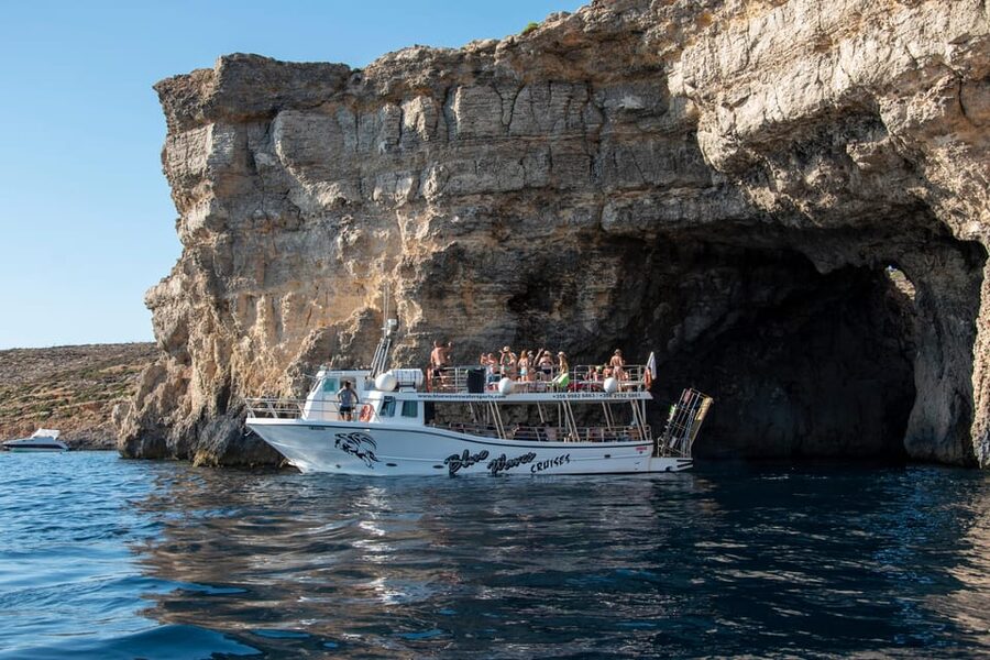 Mellieha: Comino, Crystal & Blue Lagoon 2 Bay Evening Cruise - Blue Lagoon Stop: Rocky Coves, a Small Sandy Patch, and Sunset Views