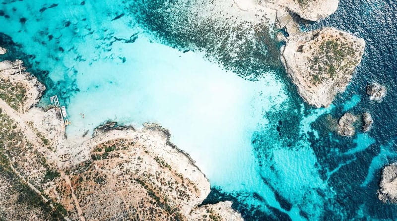 Mellieha: Round Comino, Blue Lagoon & Gozo Cruise with Water - What onboard is really like: mineral water, rooftop deckchairs, showers, and the slide