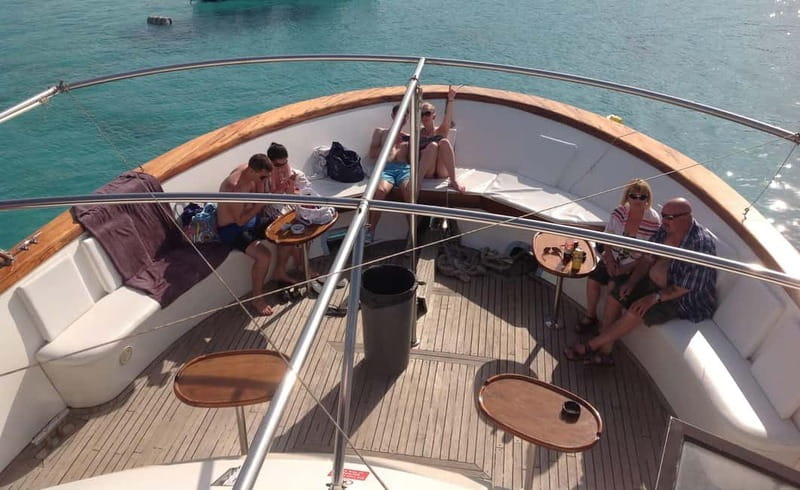 Mellieha: Round Comino, Blue Lagoon & Gozo Cruise with Water - Return cruise past Gozo and the Mġarr Harbour photo stop