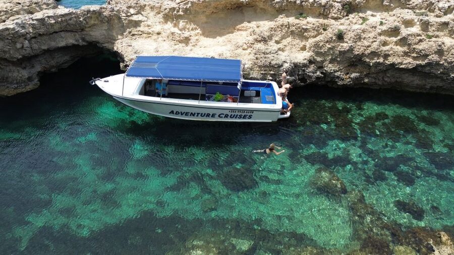 Sliema: Boat Trip to Comino Blue Lagoon, Gozo, and Caves - Comino Caves by Boat: Seeing Limestone Up Close From Sea Level